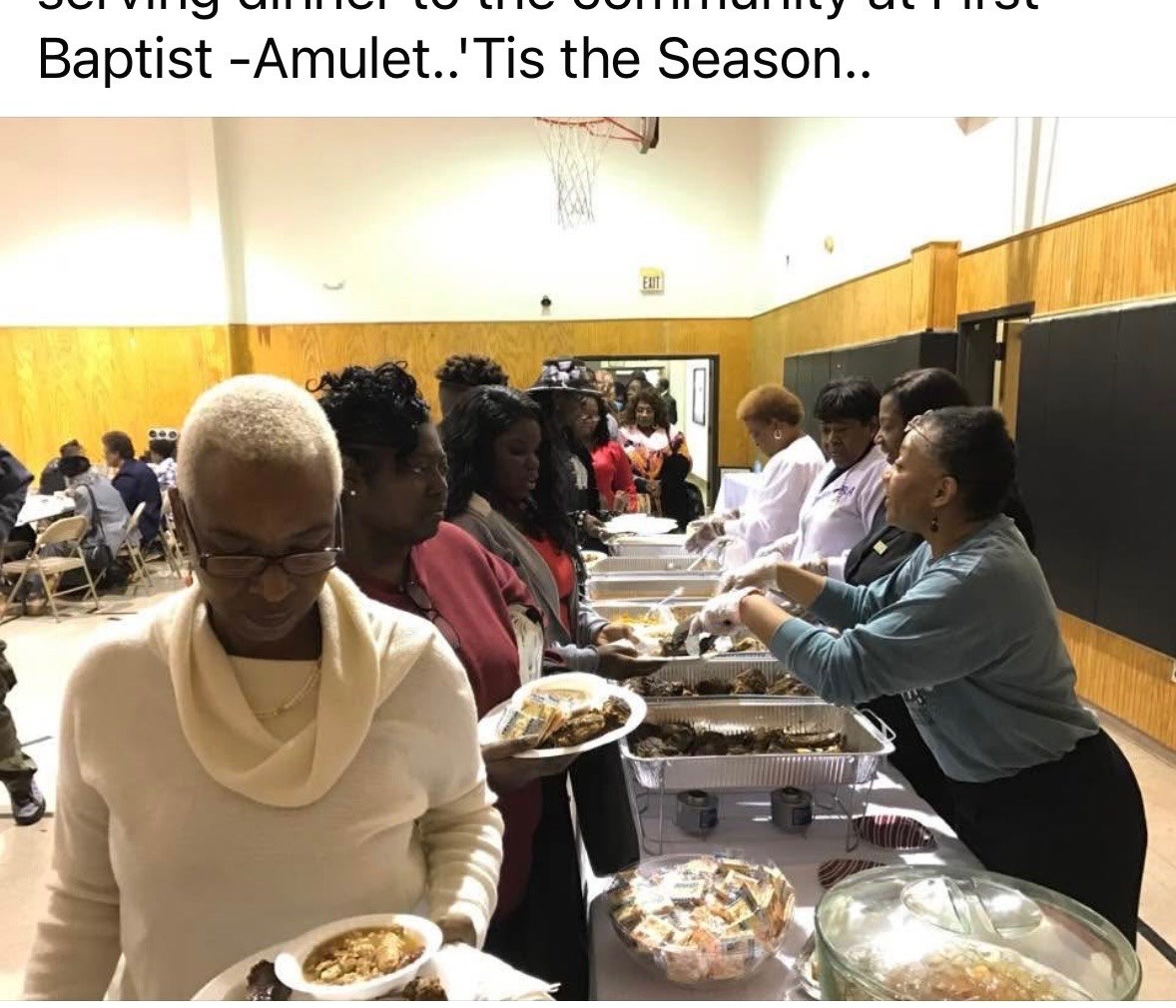 Benjamin Law Firm and Dreams Foundation serving a community dinner