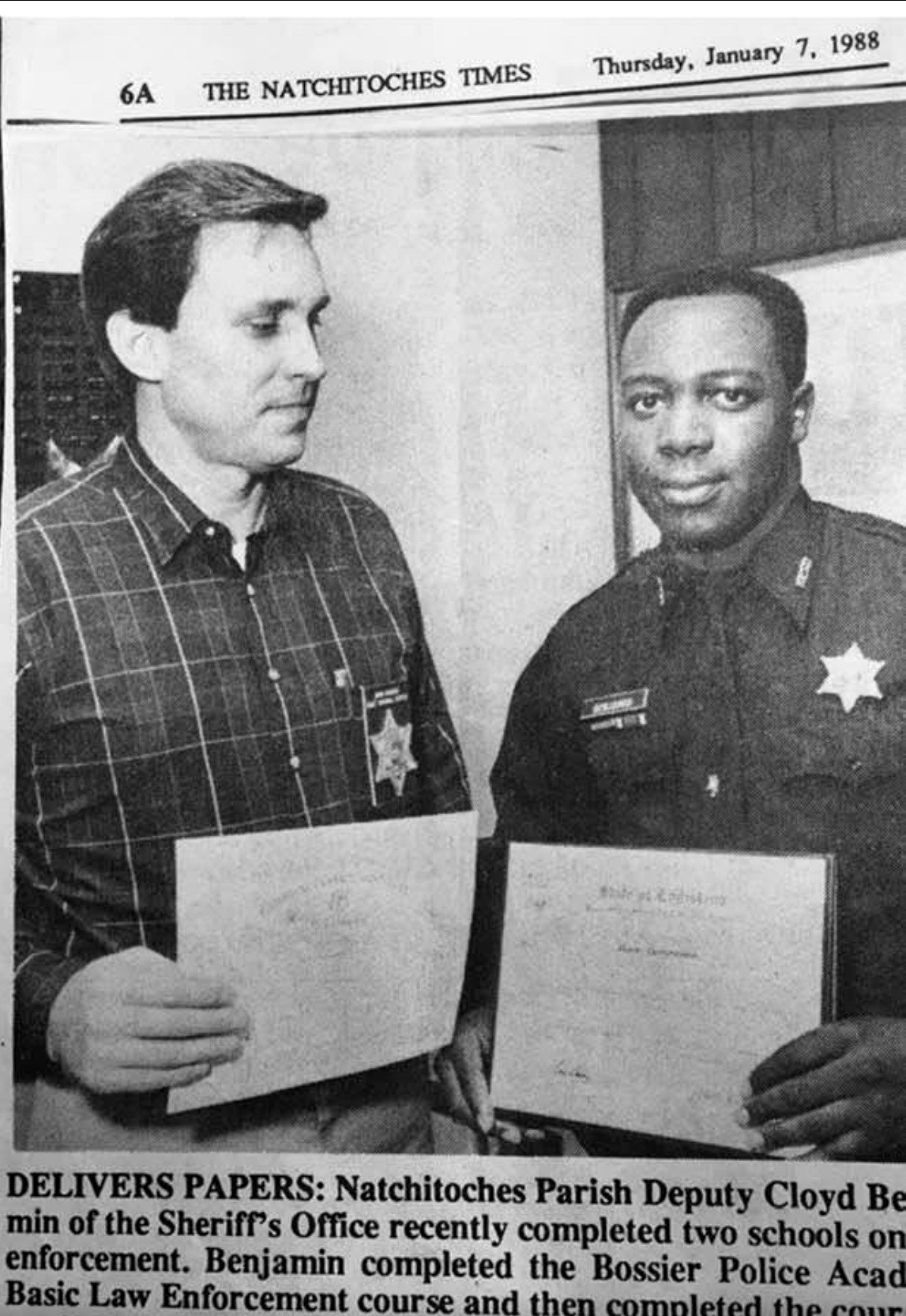 Newspaper clipping about Cloyd Benjamin completing law enforcement training