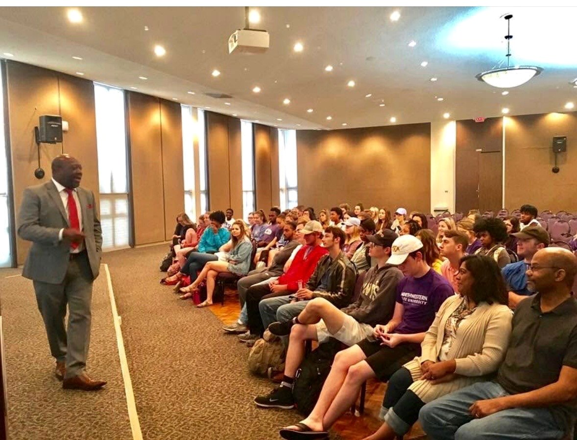 Cloyd Benjamin speaking at a public event