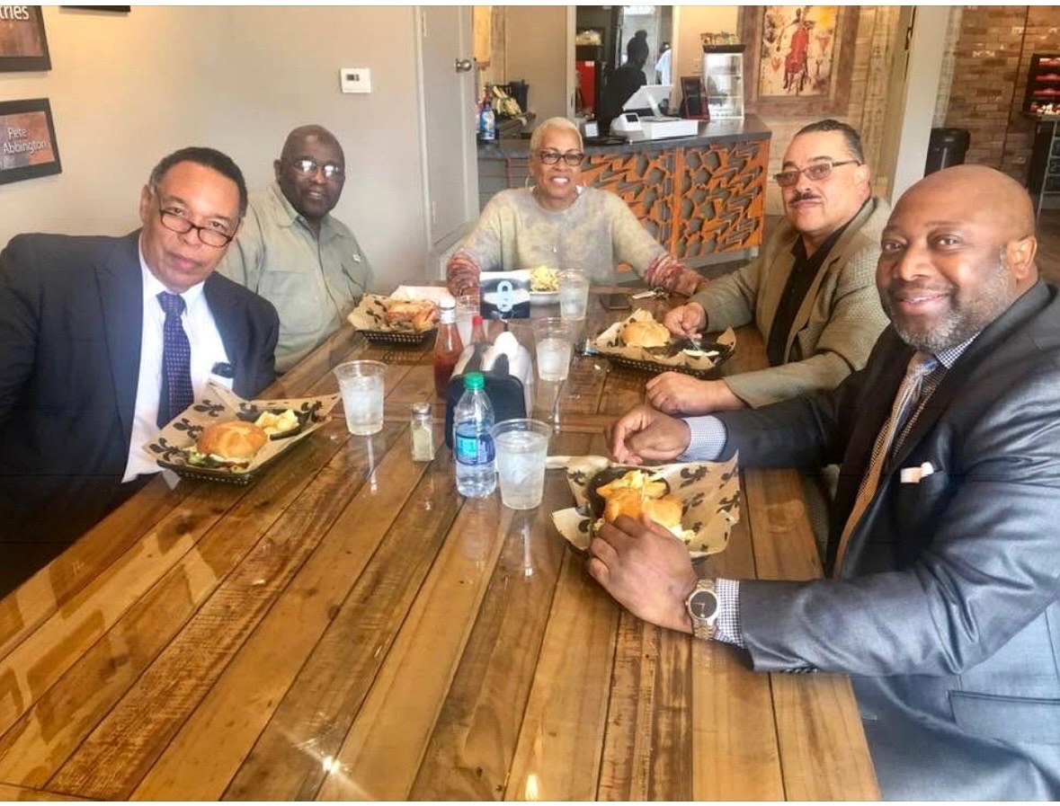 Cloyd Benjamin meeting with community leaders over lunch