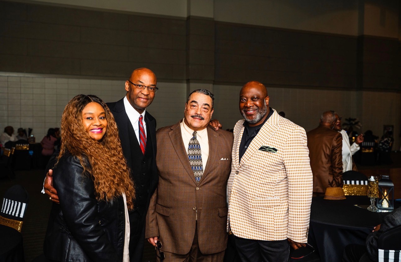 Cloyd Benjamin with friends at a community gala