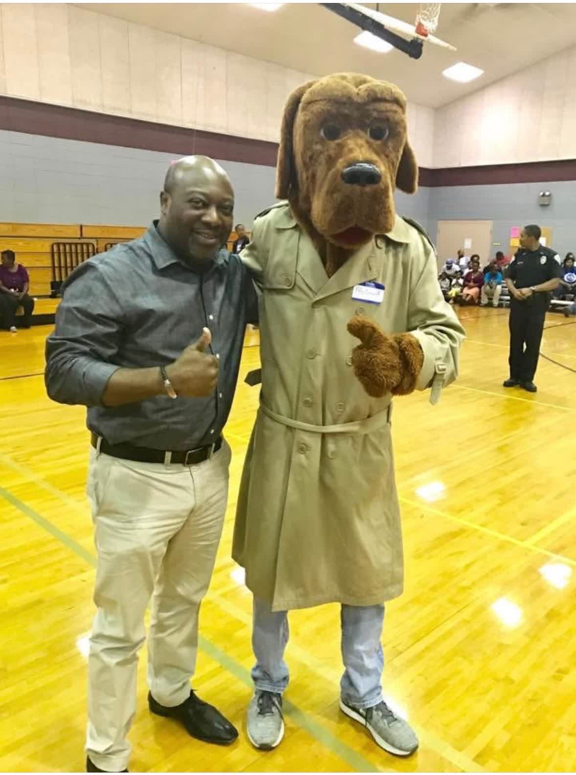 Cloyd Benjamin with McGruff the Crime Dog at a Community night out